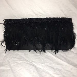 Black feather with beaded trim wristlet clutch